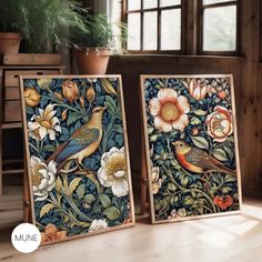 two framed paintings with flowers and birds on them in front of a potted plant