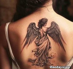 a woman with an angel tattoo on her back