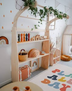 a child's playroom with toys and decor on the shelves, including an arch