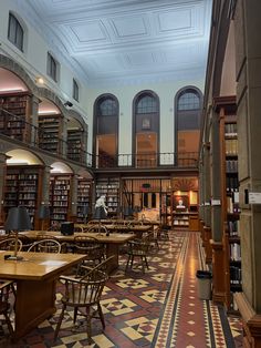 an empty library with tables and chairs in it