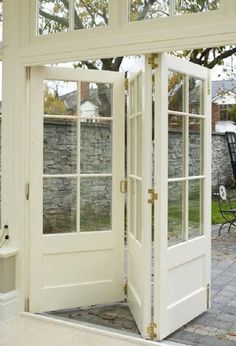 an open white door leading to a patio