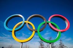 the olympic rings are displayed in front of a blue sky