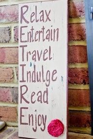 a sign that says relax, entertain, travel, indulge read, enjoy