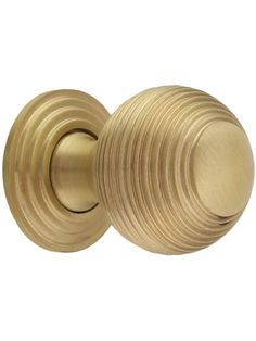 an antique brass door knob on a white background