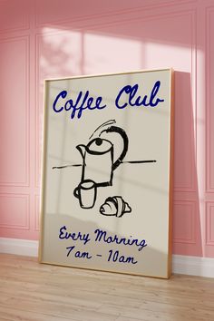 a coffee sign in front of a pink wall