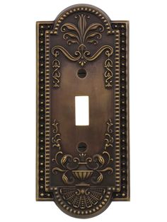 an ornate light switch plate cover