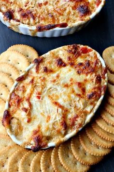 cheese and crackers are arranged on top of each other to make an appetizer