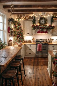 a kitchen decorated for christmas with lights and garlands on the wall, wooden counter tops