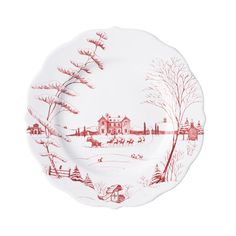 a red and white plate with a winter scene on it