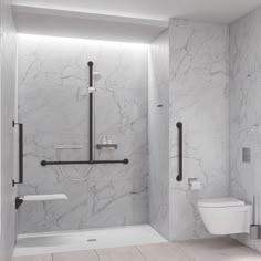 a bathroom with white marble walls and flooring, including a toilet and shower stall