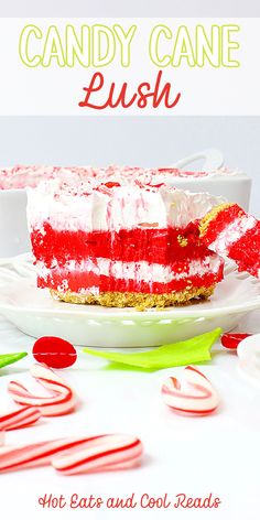 a piece of candy cane lush cake sitting on top of a white plate next to green and red utensils