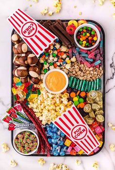 the popcorn movie night snack board is ready to be eaten