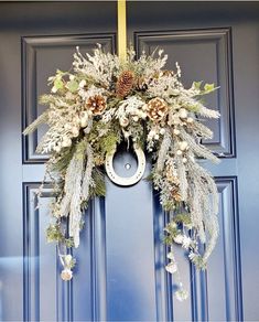 a wreath is hanging on the front door