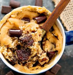 a close up of a dessert in a bowl with chocolate chunks and an oatmeal