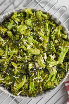 broccoli florets with shredded parmesan cheese in a bowl