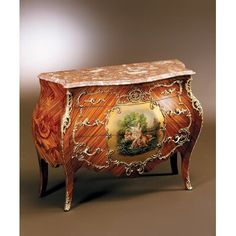 an ornately decorated wooden cabinet with marble top