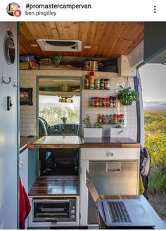 the interior of a small camper with open shelves