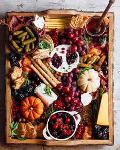 a wooden tray filled with different types of food