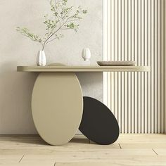 a table with two vases on it next to a white wall and a plant