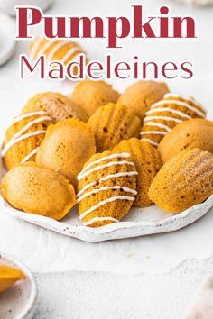 pumpkin maddelines on a plate with white icing