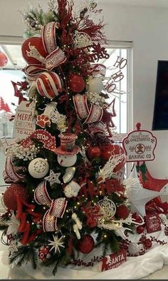 a christmas tree decorated with red and white ornaments