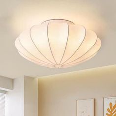 a white ceiling light in a living room