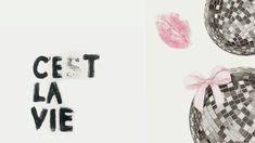 the words cest la vie are written in black and white letters with pink bows