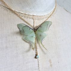 I'm obsessed by Luna moths and Opal stones. This is a delicate and dainty creation, that celebrate my love for them <3 The silk organza Luna moth (Actias Luna) measure about 5 cm wingspan. Gold chain available in different lenghts, with lobster clasp. Nickel free. The pendant is a natural raw polished Ethiopian Welo Opal that measures about 3 to 5 mm and is attached with structural adhesive. Every opal stone used is unique, nearly transparent with colorful fire. Please allow for slight differ Luna Moth Jewelry, Whimsical Handmade Butterfly Necklace, Moth Jewelry, Colorful Fire, Luna Moths, Moth Necklace, Necklace Opal, Luna Moth, Gold Choker Necklace