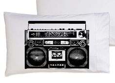 two pillows with an image of a boombox and radio cassette player printed on them