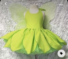 a green fairy dress on a mannequin