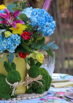 a vase filled with flowers sitting on top of a table