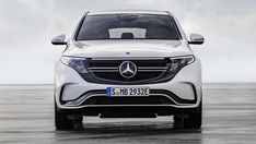 the front end of a white mercedes suv