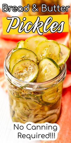 a jar filled with pickles sitting on top of a red cloth covered tablecloth