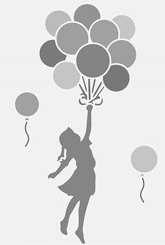 a woman holding up balloons in the air