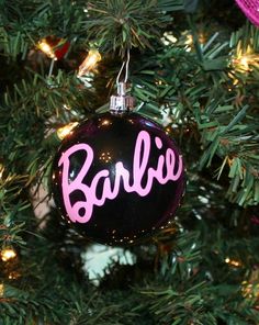 a baubie ornament hanging from a christmas tree