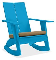 a blue rocking chair with a green cushion on the seat and backrests, against a white background