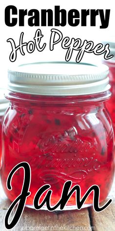 cranberry hot peppers in a mason jar with text overlay that reads, cranberry hot peppers jam