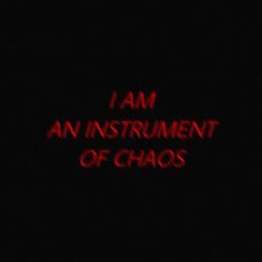 the words i am an instrument of chaos are lit up in red against a black background