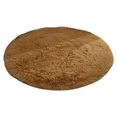 a round rug that is made out of sheepskin