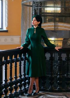 Fitted Long Sleeve Dark Green Midi Dress, Dark Green Fitted Long Sleeve Midi Dress, Fitted Dark Green Long Sleeve Midi Dress, Vintage Green Winter Dresses, Green Vintage Winter Dress, Green A-line Winter Dress, Green A-line Midi Dress For Winter, Elegant Green Long Sleeve Dress For Fall, Winter Green Fitted Dress