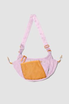 Introducing Crescent Crossbody, designed with lightweight, technical materials, geometric functionality, and intuition. Volume: 4.7 Liters Size: H 8.5in x W 12.2in x D 2.8in Strap length: 59in Shell: 210D recycled nylon N66 baby ripstop Lining: 75Dx150D recycled poly ripstop Trendy Nylon Shoulder Bag For Outdoor Activities, Versatile Purple Nylon Shoulder Bag, Trendy Nylon Shoulder Bag For Outdoor, Trendy Outdoor Nylon Shoulder Bag, Purple Nylon Bags For Outdoor Use, Purple Nylon Bag For Outdoor Use, Purple Nylon Bag For Outdoor, Summer Nylon Shoulder Bag With Pockets, Pink Nylon Shoulder Bag For Everyday Use