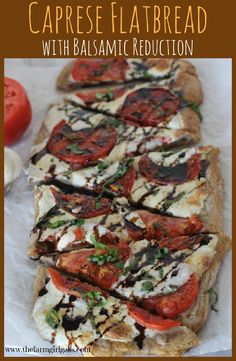 a close up of a pizza with tomatoes on it and the words caprese flatbread with balsamic reducer