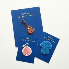 two cards with clothes and a guitar on them