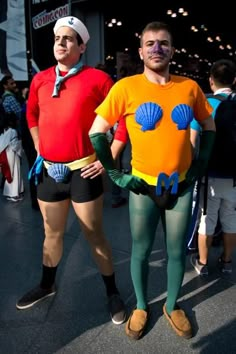 two men in costumes standing next to each other