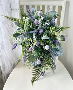 a bouquet of flowers sitting on top of a white table