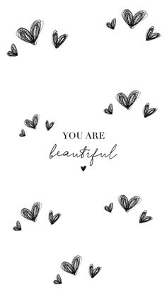 the words you are beautiful written in black ink on a white background with small hearts