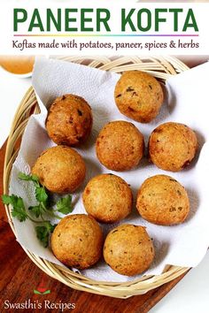 a basket filled with muffins on top of a wooden table