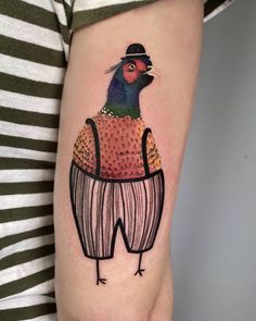 a bird with a hat on it's head in a sweater