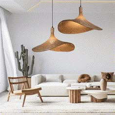 a living room filled with furniture and hanging lights