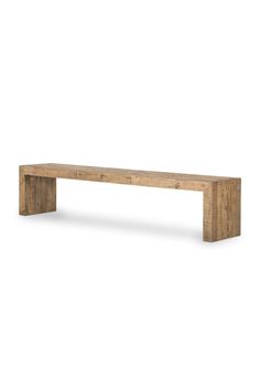 a wooden bench sitting on top of a white floor